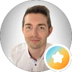 Man in white shirt with a star icon overlay, likely representing a profile or achievement.